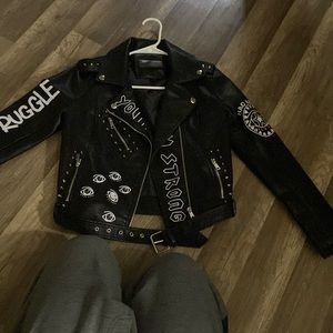 Selling a custom leather jacket. Printed works, zippers and strap